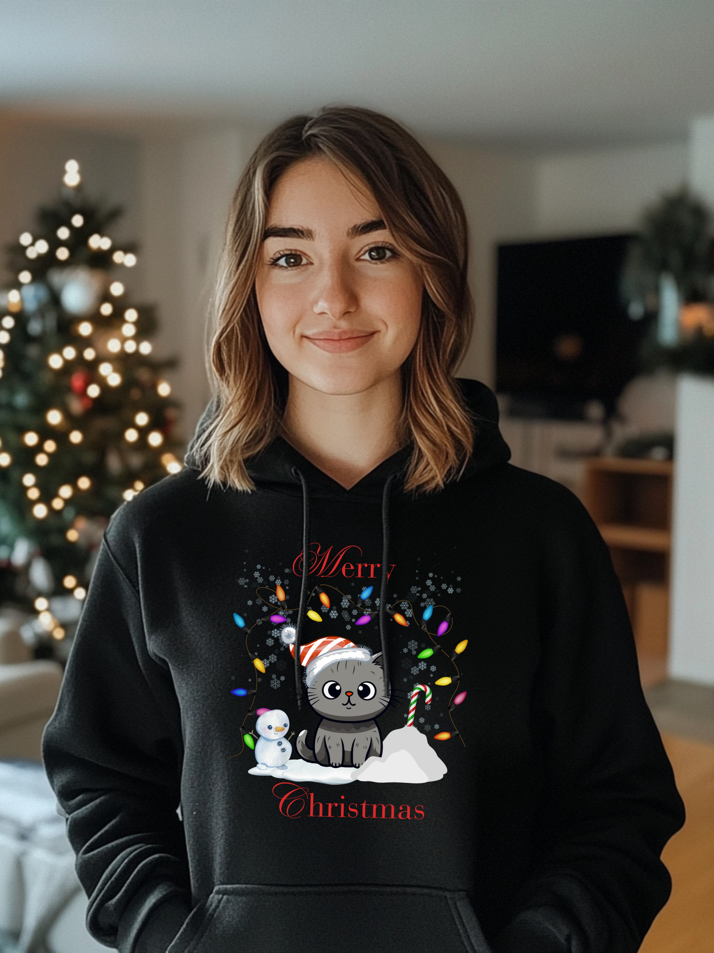 Frontansicht eines Hoodies mit einer suesser Katze die eine Weihnachtsmuetze traegt und Schriftzug